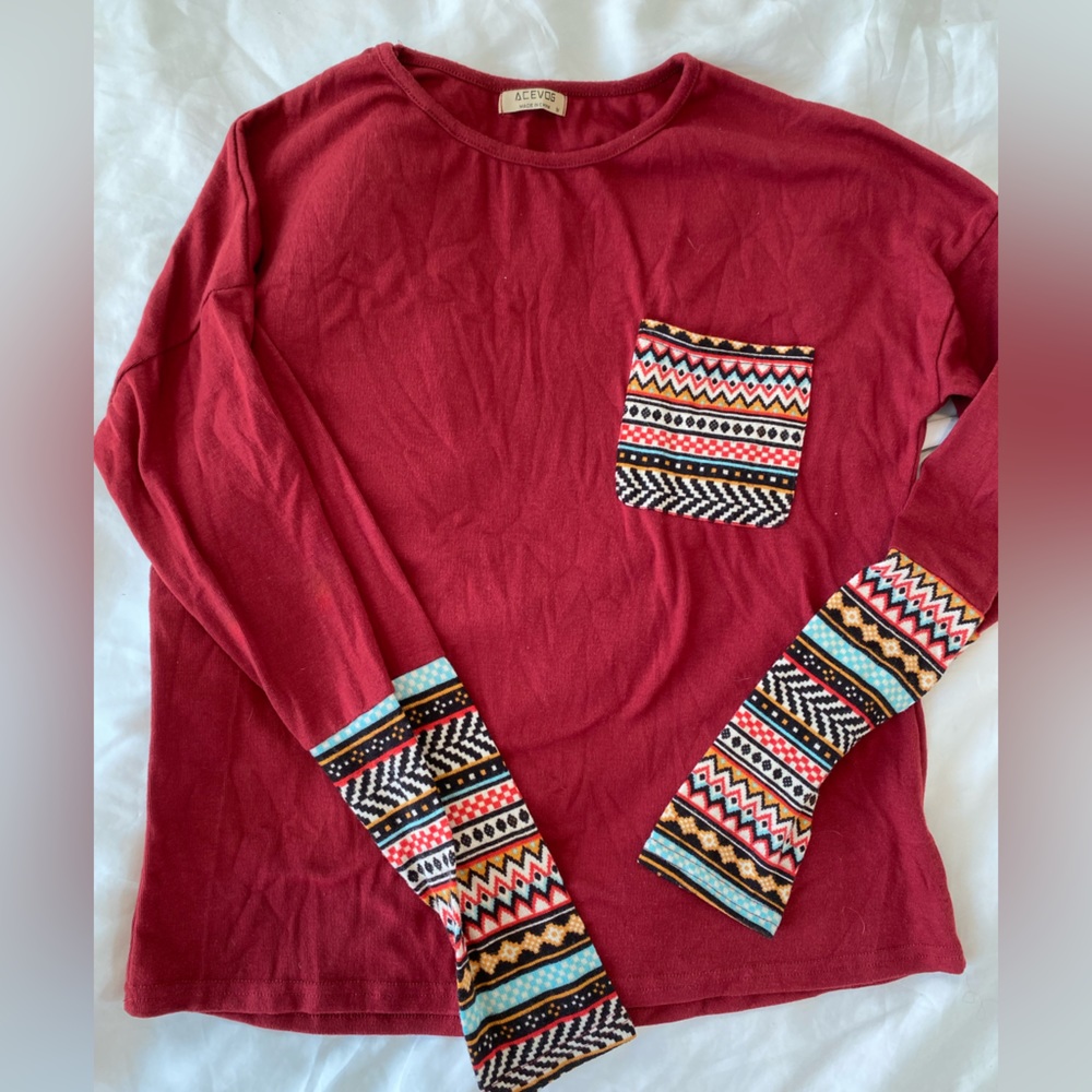 Comfortable red long sleeve shirt with decorative pocket and sleeves size M